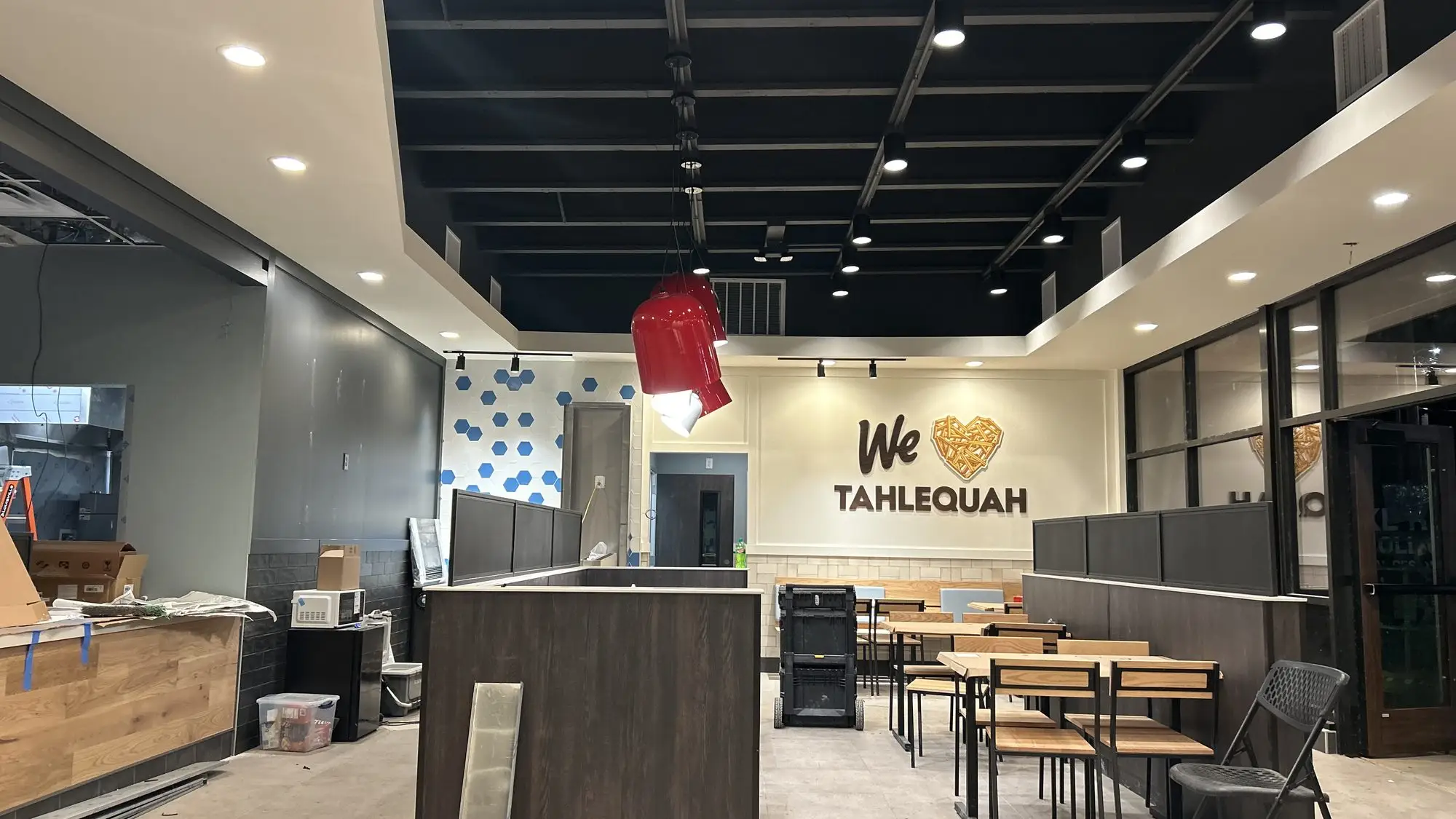 A finished cafe interior with the lighting and power complete