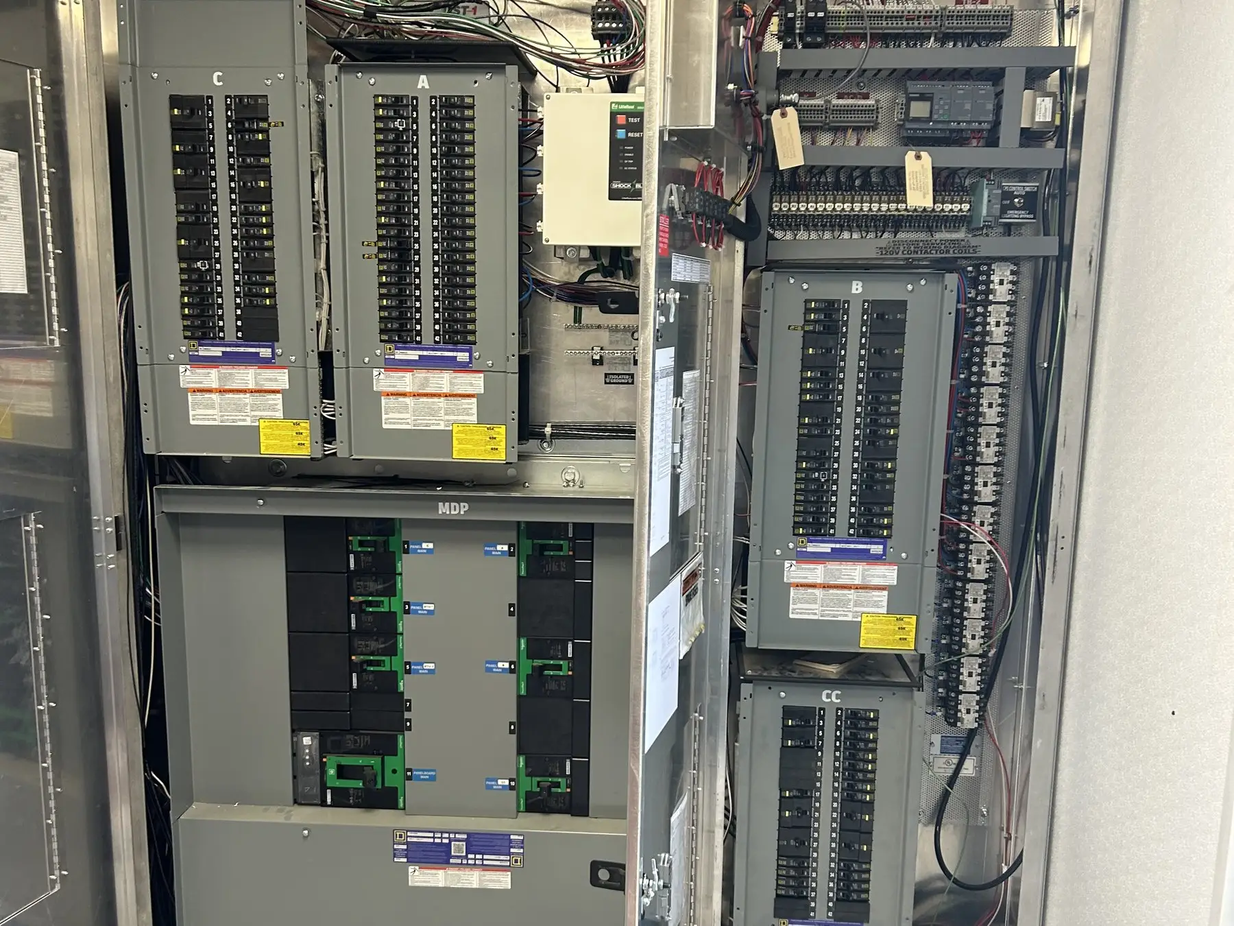 The inside of a commercial switchgear line-up with breakers and control wiring